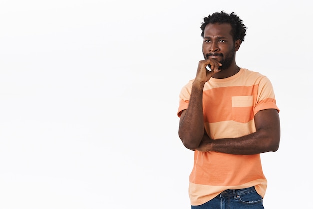 Pensive young african-american man looking troubled