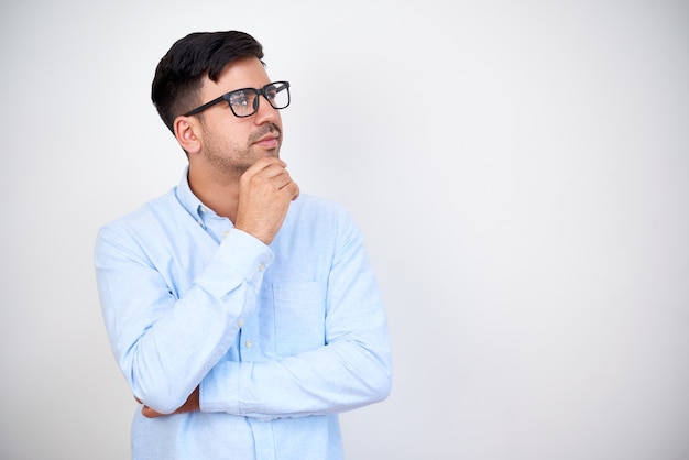 Pensive young entrepreneur in glasses