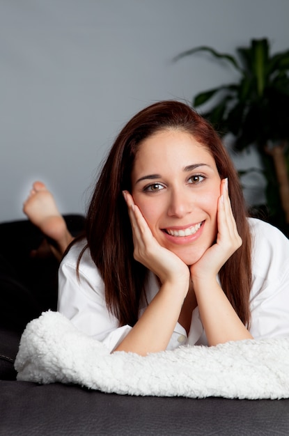 Pensive young girl relaxing at home