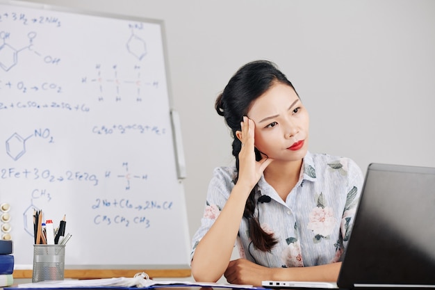 Pensive young science teacher