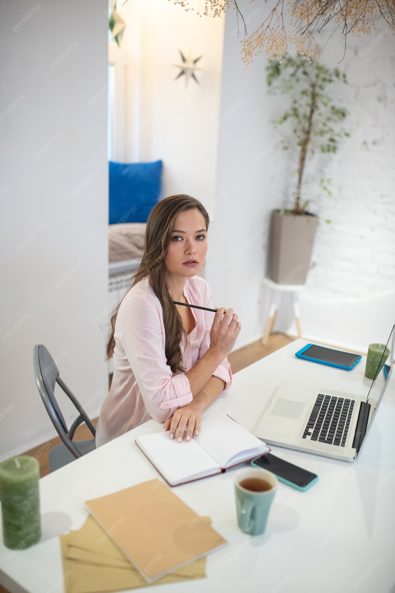 Premium Photo  Pensive woman sitting at table while thinking