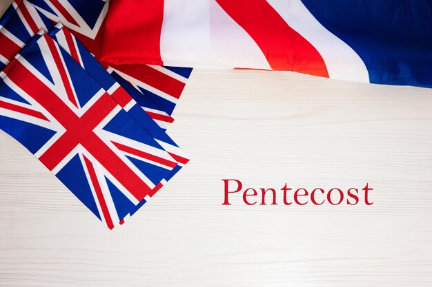 Pentecost British holidays concept Holiday in United Kingdom Great Britain flag background