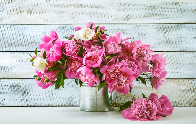 Peonies in tin bucket