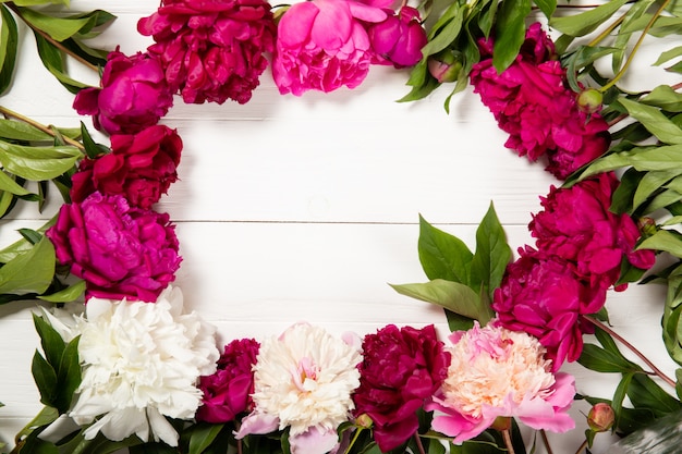 Peonies on a wooden background. Place for text