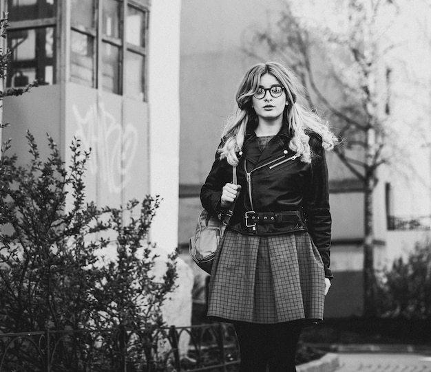 People abd fashion concept young woman in the city summer time black and white picture