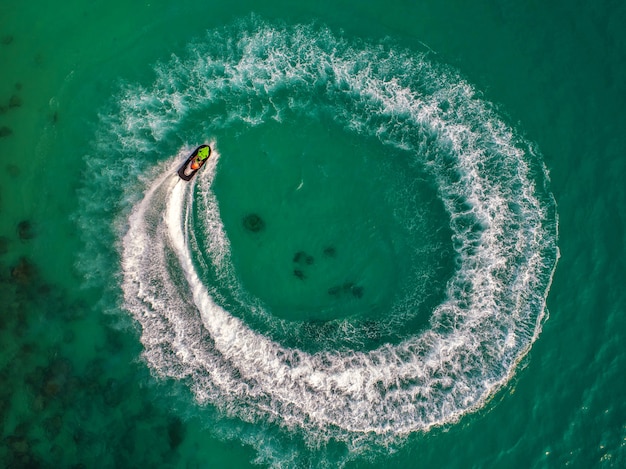 People are playing jet ski at sea during the holidays. 