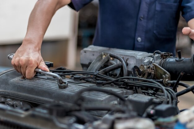 People are repair engine Use a wrench to work