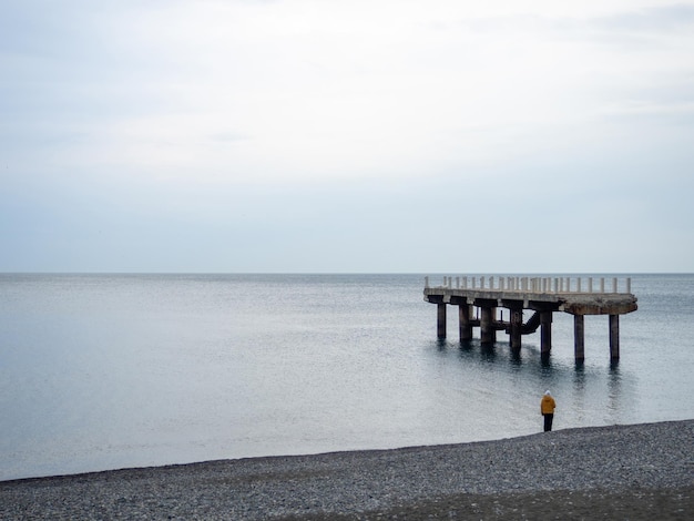 People are walking along the pier Cold season at the resort Not a season broken pier