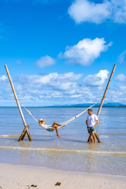 People at beach against sky