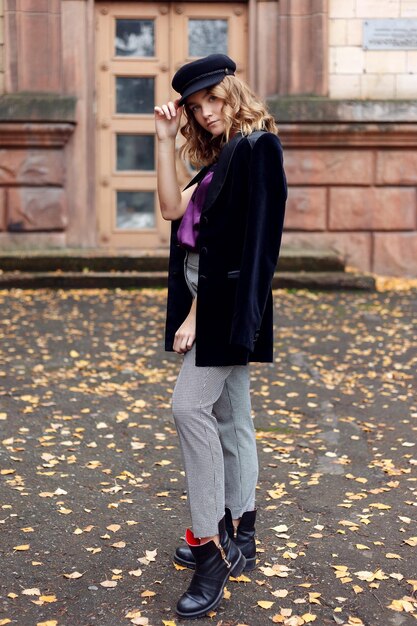 People, beauty, fashion, lifestyle and color concept - Outdoor full body portrait of young beautiful happy smiling girl posing on street. Model looking at camera. Lady wearing stylish clothes