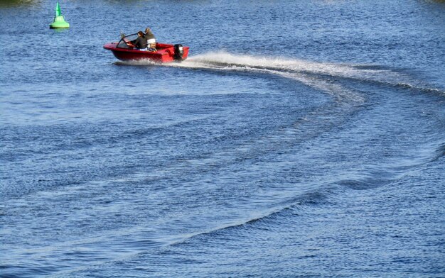 People in boat on sea