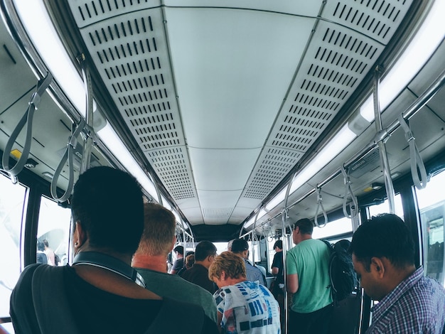 People in bus at airport