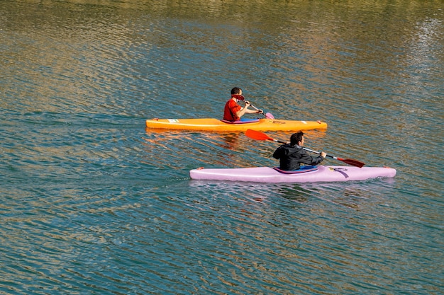 People in canoe in the Bilbao river Spain