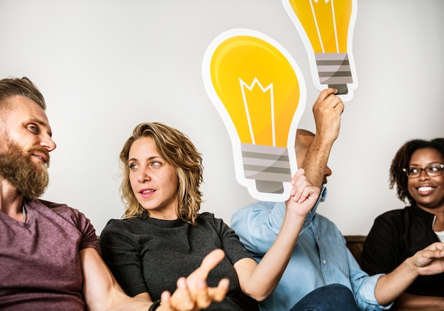 People carrying light bulb icons