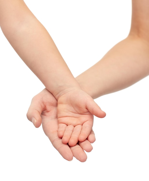 people, charity, family, children and advertisement concept - close up of woman and little child hands holding empty palms