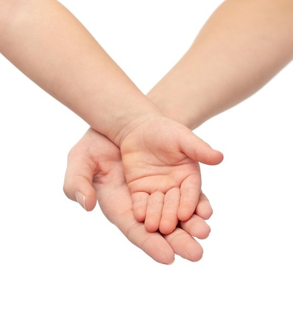 people, charity, family, children and advertisement concept - close up of woman and little child hands holding empty palms