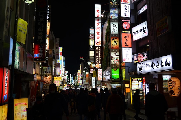 people on city street at night