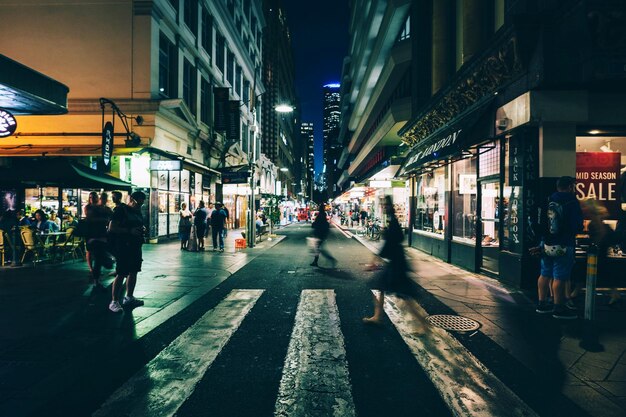 People on city street at night