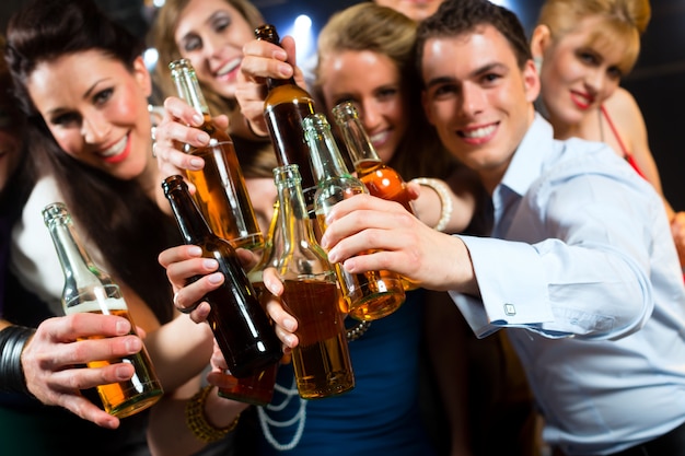 People in club or bar drinking beer