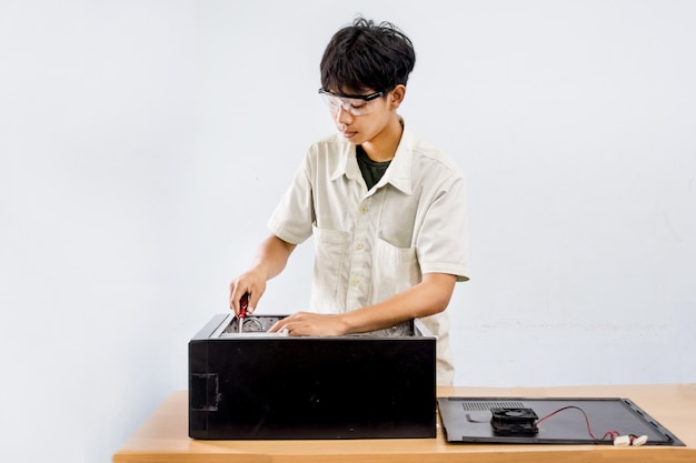 People Computer repair with screwdriver in service center concept