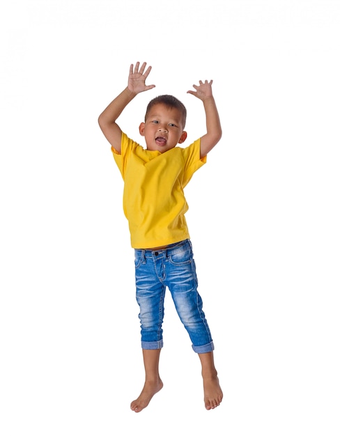 People concept happy little asian boy jumping in air happiness, childhood, freedom in movement isolated on white