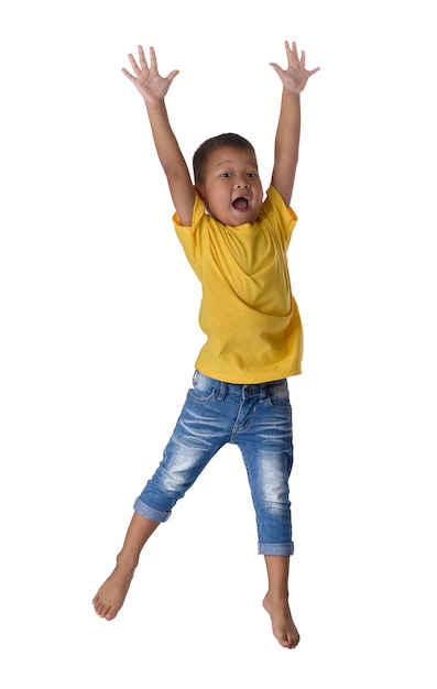 People concept happy little asian boy jumping in air happiness, childhood, freedom in movement