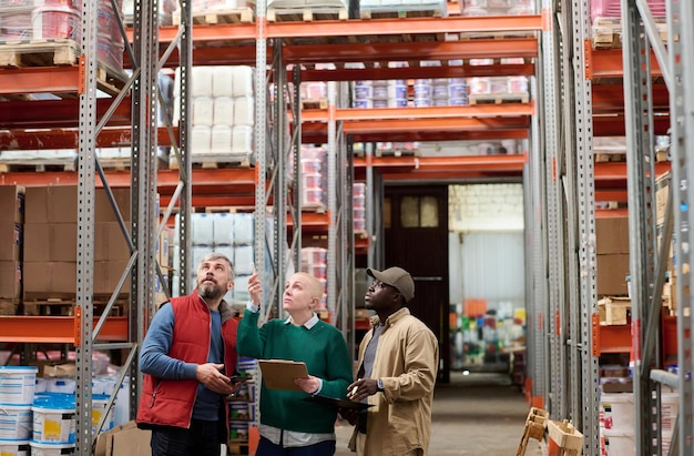 People counting goods in stock