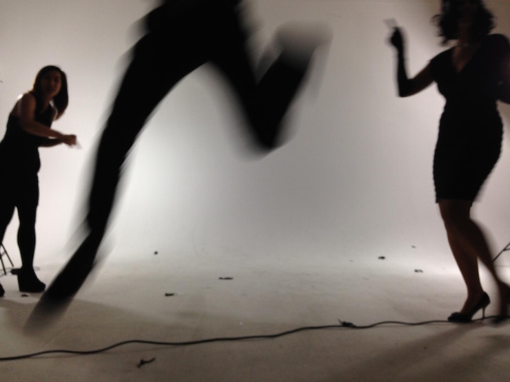 Photo people creating an active photo shoot in a studio