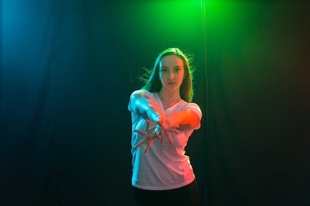 People and dancing concept - Close up portrait of jazz funk dancer woman in studio.