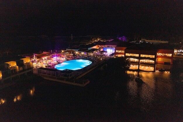 People dancing on the show in a luxury hotel. aerial view.\
night show with people partying with light music.