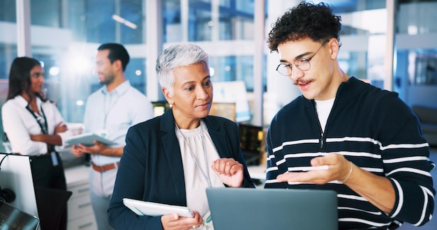 people developer and mentor on laptop in office of programming coding training and server update staff manager and helping of app testing it intern and web application and troubleshooting system