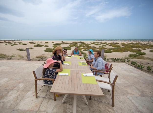 People dine in the restaurant at the outdoor dining table