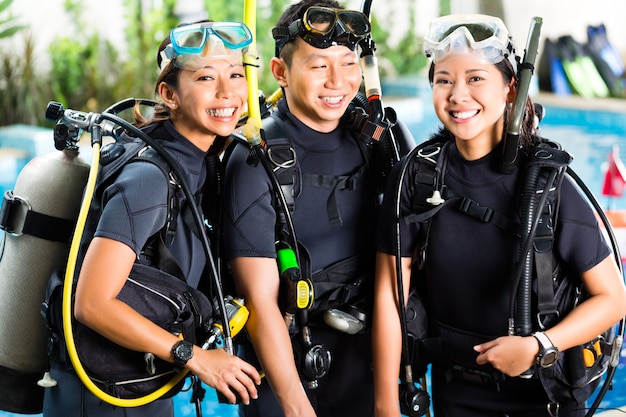 People in diving school, students and master