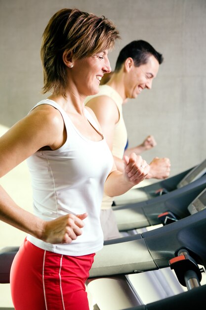 people doing treadmill exercises