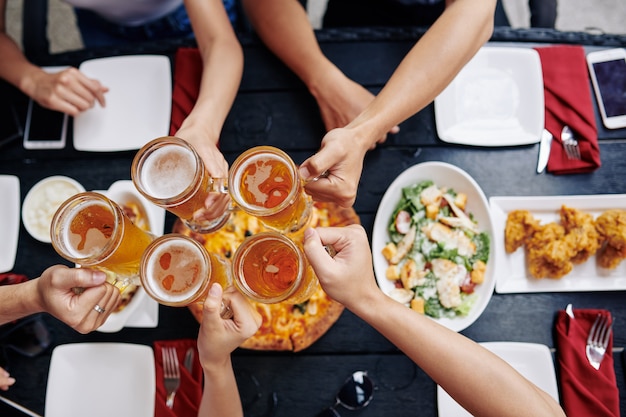 People drinking beer in bar