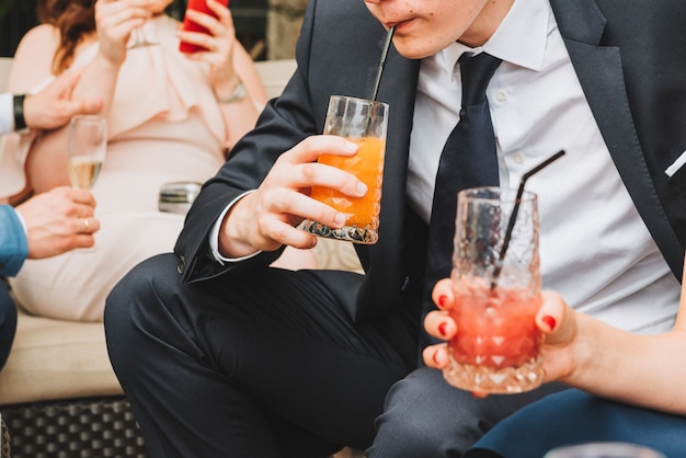 People drinking soft drinks at a social event