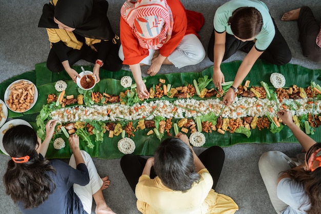 People eating kembulan shot from above