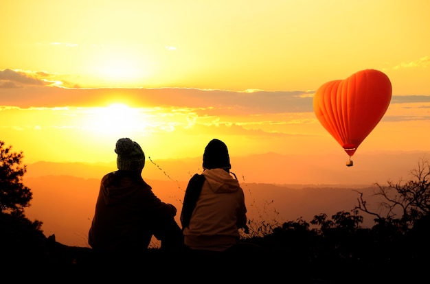 People enjoyed sunrise at the mountain top.