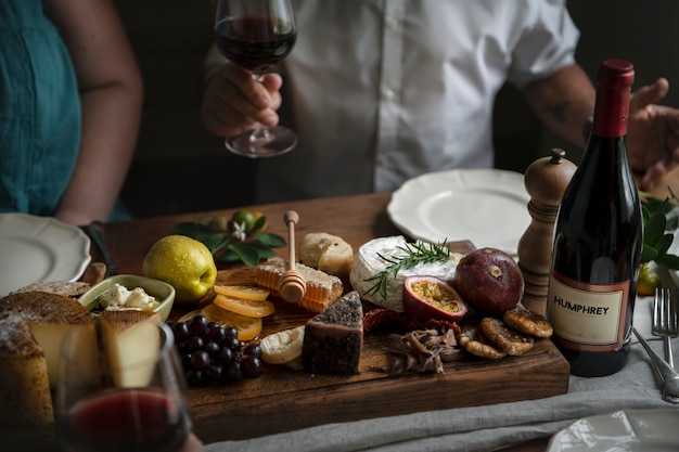 Photo people enjoying a cheese platter food photography recipe idea