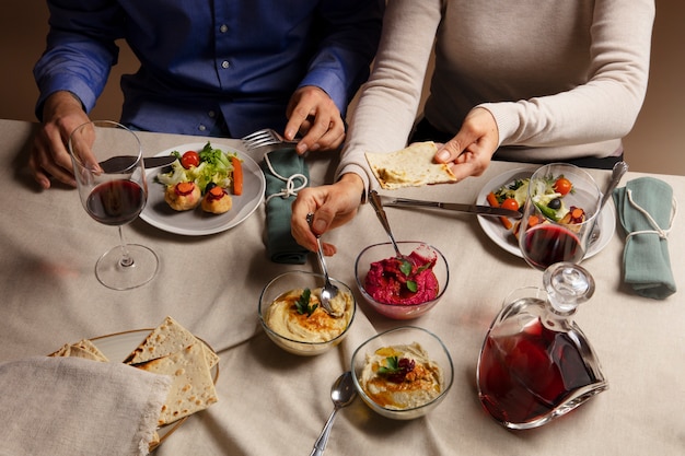 People enjoying a feast for the first day of passover seder