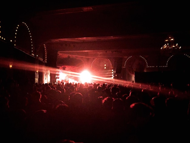 Photo people enjoying music concert at night