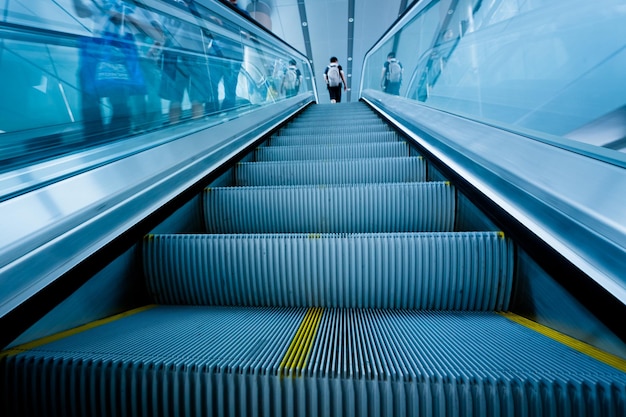 People on escalator at subway station