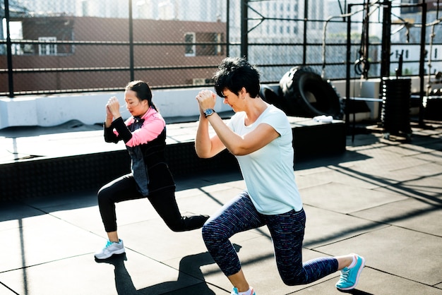 People exercising at fitness gym