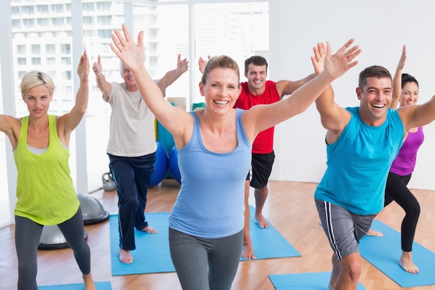 People exercising in gym class