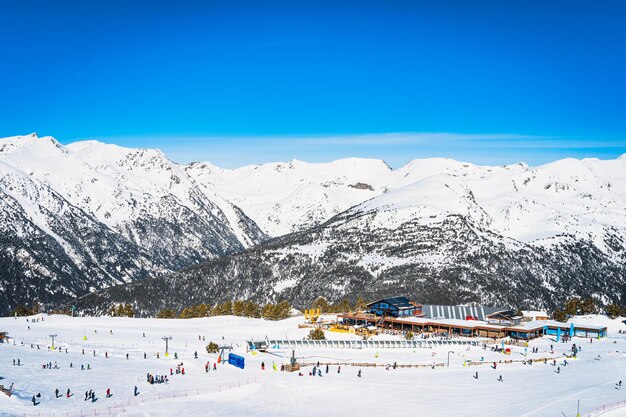 People families skiers and snowboarders relaxing and having fun in winter at soldeu andorra