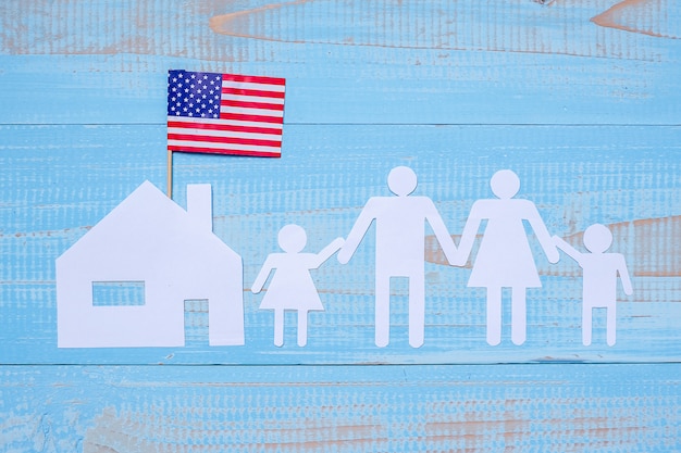 People or Family and home paper shape with  flag of the United States of America 