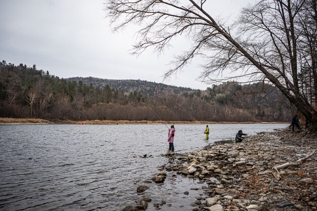 People fishing in a river