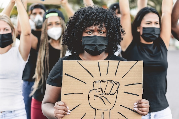 People from different culture and races protest on the street for equal rights