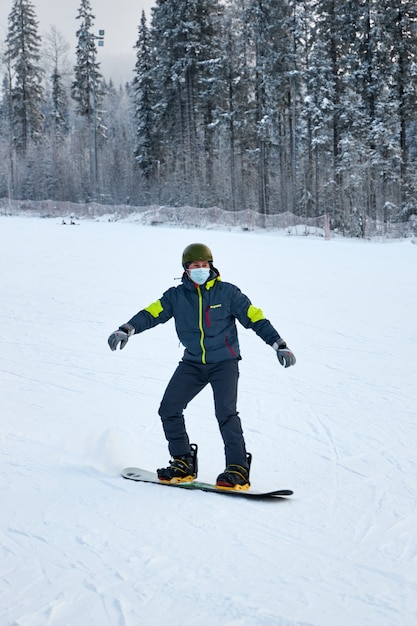 People go snowboarding and skiing, winter recreation and\
sports. skiing down the mountain on a snowboard, funny emotions on\
the faces of men and women