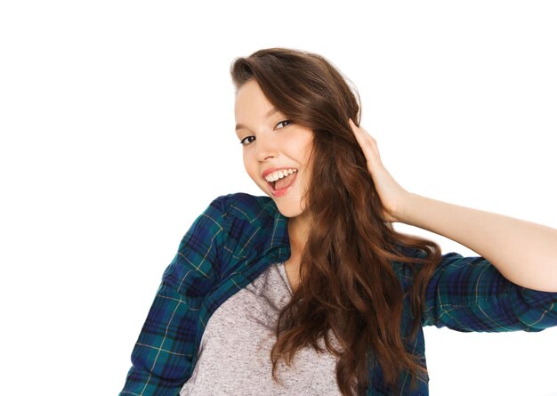 people, hair care, style and teens concept - happy smiling pretty teenage girl touching her head